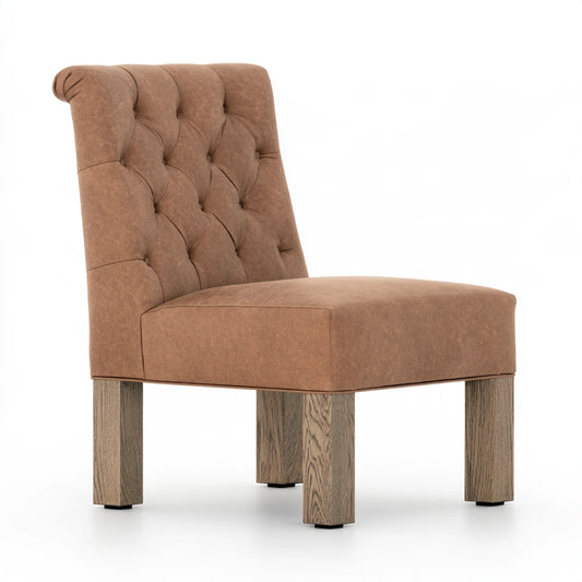 Thestudyandstool cognac brown leather dining chair with upholstered seat and back, modern design, viewed from the side.