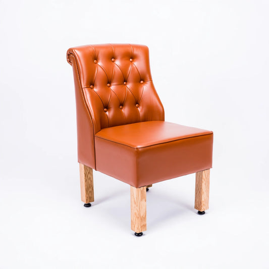 Thestudyandstool leather dining chair in cognac brown with upholstered tan leather seat and backrest, modern and stylish design.