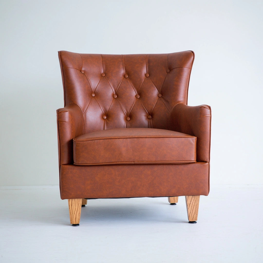 Thestudyandstool cognac brown leather dining chair with upholstered seat and back, showcasing a modern and comfortable design.