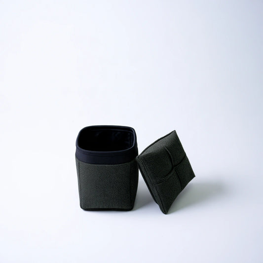 Grey fabric storage box with open top, cube shape, from thestudyandstool, ideal for organizing and storing items.